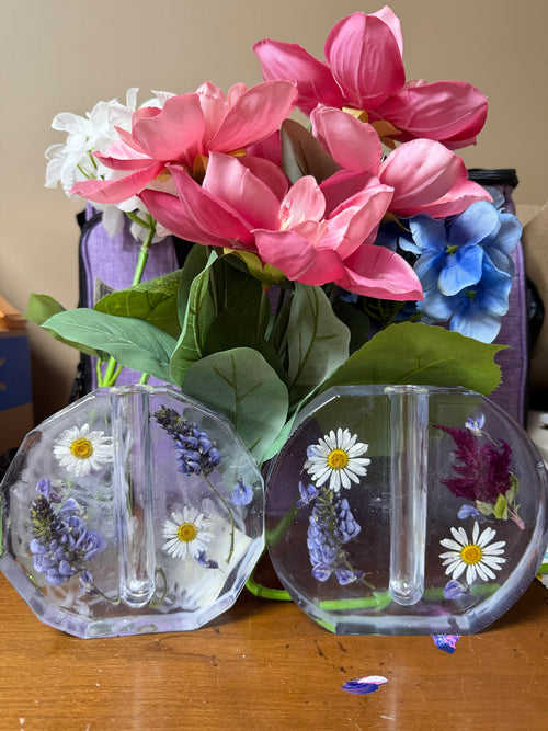 Custom resin tube vase set with pressed flowers embedded in clear resin bases holding glass test tube vases